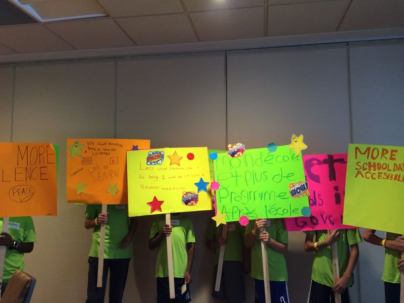 Union School for Children participants holding picket signs they created.